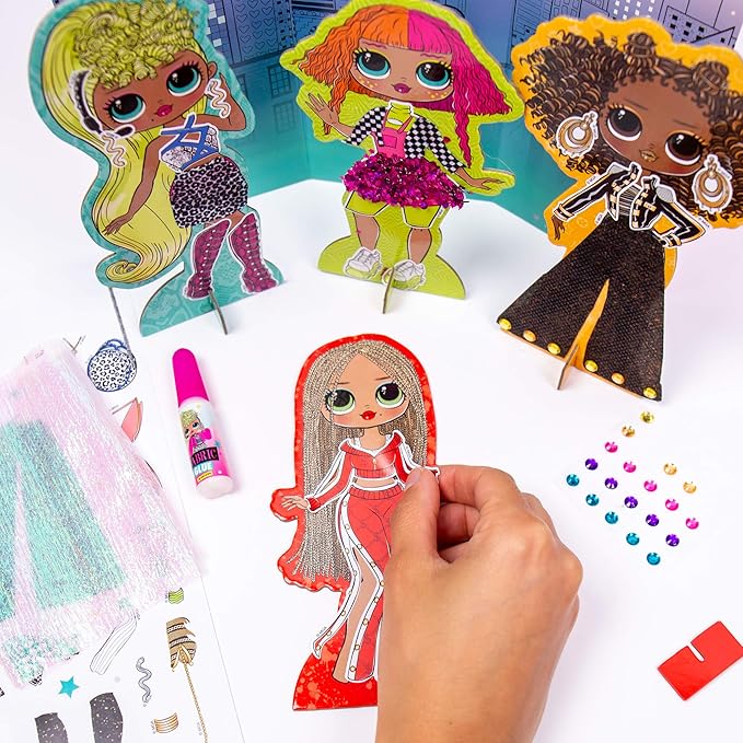 L.O.L. Surprise! LOL OMG Dress Up Studio by Horizon Group USA, Decorate 4 Dolls with Over 100 Accessories, DIY Fashion Craft Kit, Mix & Match Fabrics & Patterns, Use Gemstones, Stickers & More